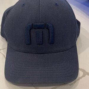 Travis Mathew Navy Flexfit Tech Hat Label
